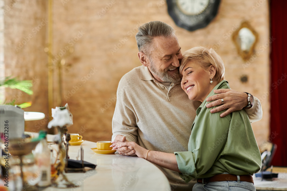 Mature couple shares a romantic moment during their charming cafe date