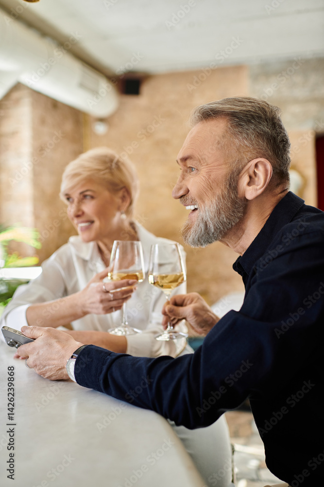 Romantic evening at a cozy bar with a stylish mature couple sharing laughter and drinks Romantic evening at a cozy bar with a stylish mature couple sharing laughter and drinks