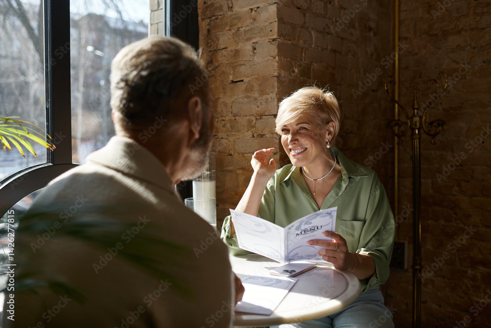 Romantic dinner for a mature couple enjoying a cozy evening together