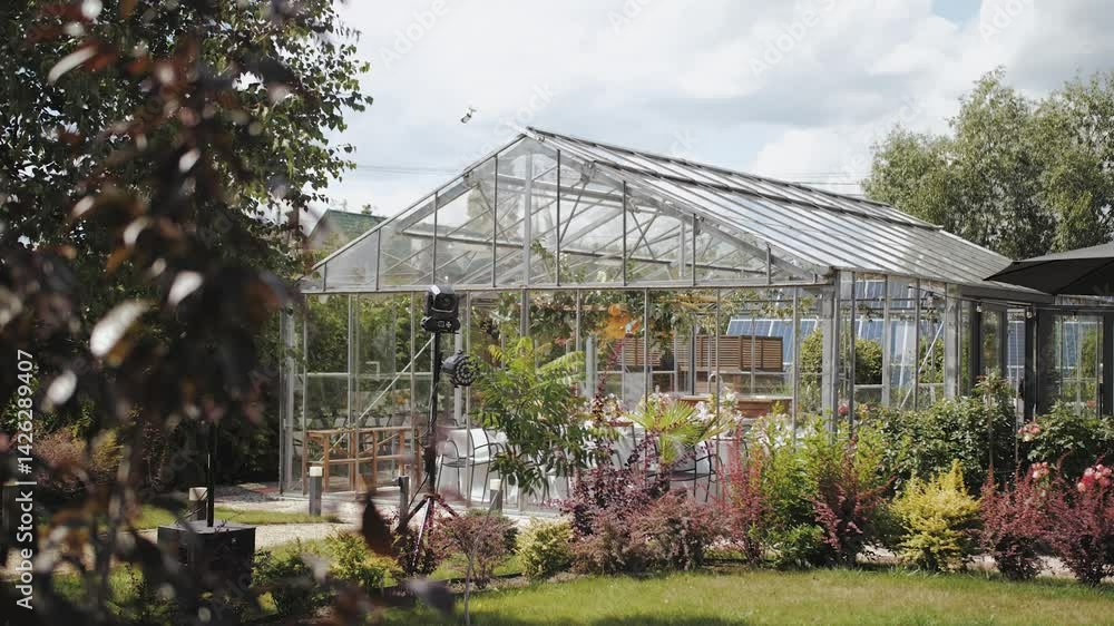 This is a beautiful greenhouse, perfectly surrounded by lush, vibrant gardens and greenery, where the wedding takes place. Wedding decor, tent decor, decorated tables. This is a beautiful greenhouse, perfectly surrounded by lush, vibrant gardens and greenery, where the wedding takes place. Wedding decor, tent decor, decorated tables.