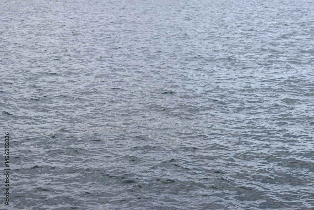 Adriatic Sea. Natural background. Space. Sea with small waves, ripples on the water. Water surface with small waves. Background Adriatic Sea. Natural background. Space. Sea with small waves, ripples on the water. Water surface with small waves. Background