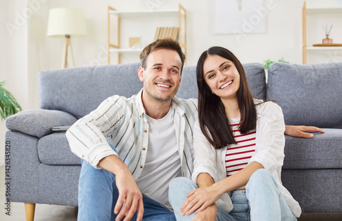 Obraz na płótnie Loving smiling family healthy relationship, sitting close at home, married couple after buying house, happy mortgage agreement, apartment renters, apartment owners, relocation tenant service w salonie