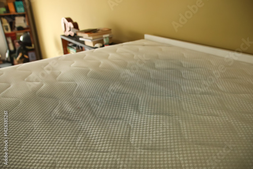 Obraz na płótnie Dirty mattress pad on bed. stained and moldy protector showing signs of age and neglect, highlighting home hygiene, health risks, and the need for replacement or cleaning w salonie