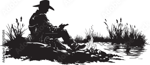 Silhouette of a cowboy sitting by a campfire near a river surrounded by grass and reeds
