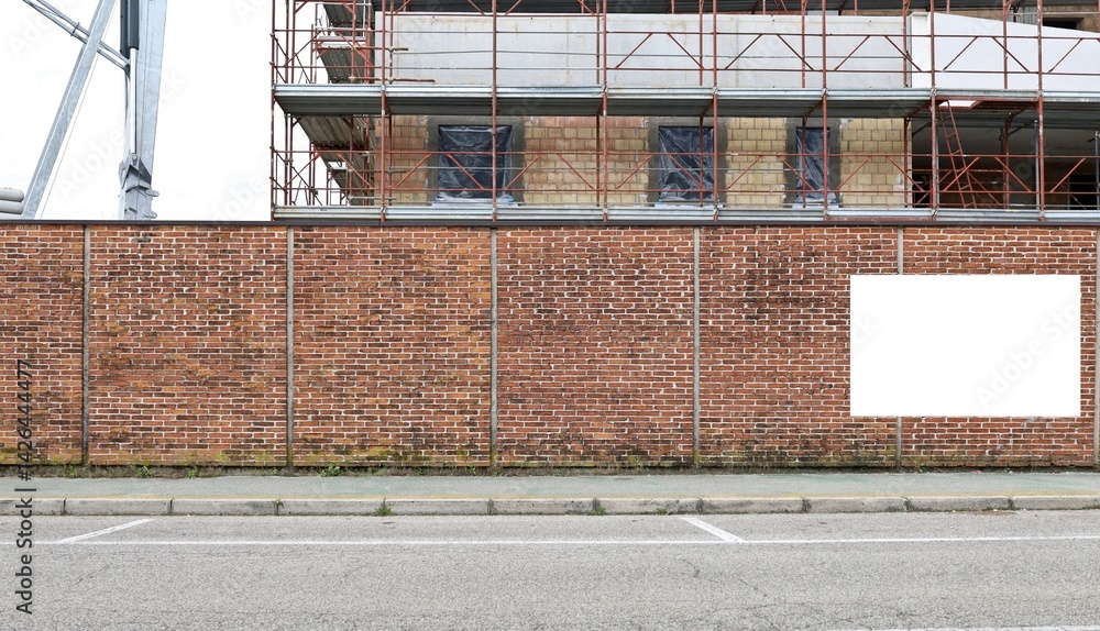 custom made wallpaper toronto digitalBrick wall outside the construction site with a blank information board on the right. New building with brick facade and scaffolding on behind. Background for copy space.