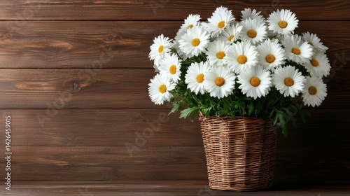 A basket full of white daisies sits on a wooden table