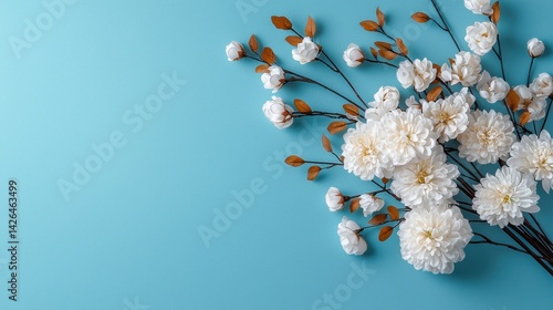 A bouquet of white flowers is arranged on a blue background