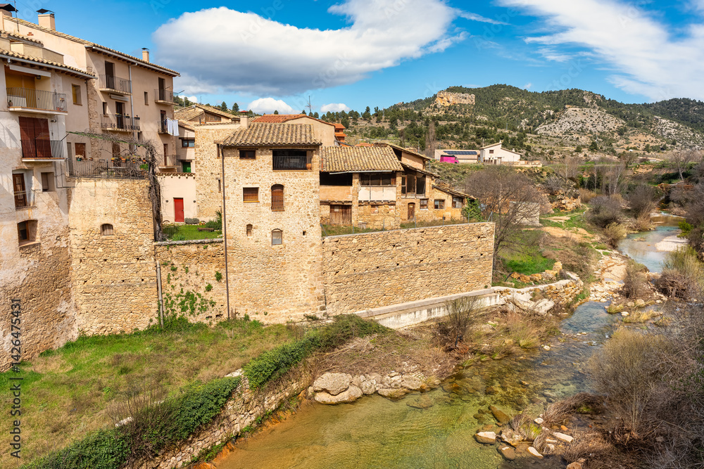 Old stone houses by the river in the town of Beceite, Teruel, Aragon.