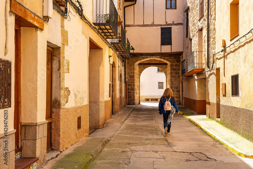 Obraz na płótnie Tourist woman strolling through the picturesque streets of the beautiful medieval town of Beceite, Teruel. w salonie