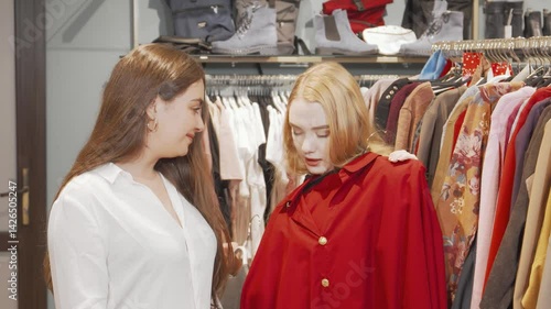 Wallpaper Mural In a vibrant clothing boutique, two fashionable friends excitedly discuss their outfit choices while trying on trendy dresses. The atmosphere buzzes with joy and camaraderie, showcasing the thrill of Torontodigital.ca