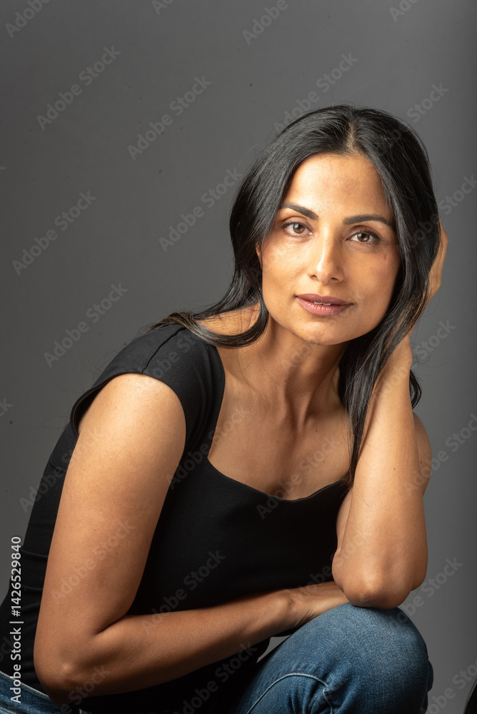 Beautiful Asian Indian woman in studio fashion shoot. Beautiful Asian Indian woman in studio fashion shoot.