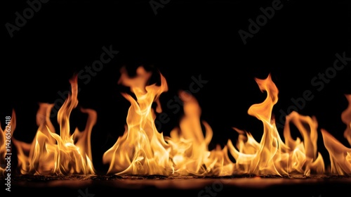 Wallpaper Mural Fiery flames dance against a stark black background, creating a dramatic and intense image. Torontodigital.ca