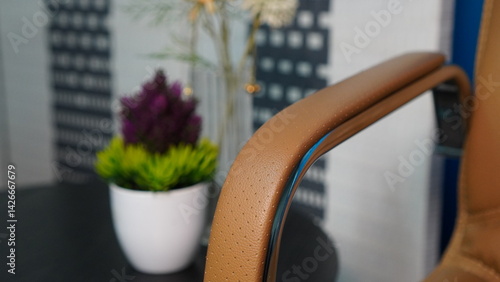 Obraz na plátne Ergonomic Office Chair Armrest with Flower Pot Enhancing Workplace Comfort