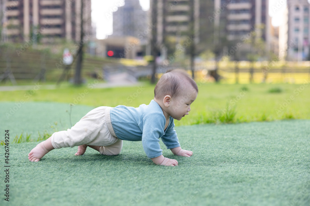 Little baby explore park on sunny day