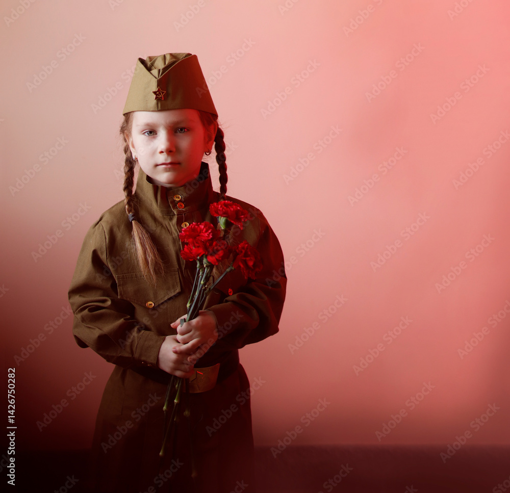Obraz premium portrait of a girl with flowers on Victory Day in May in a green military suit