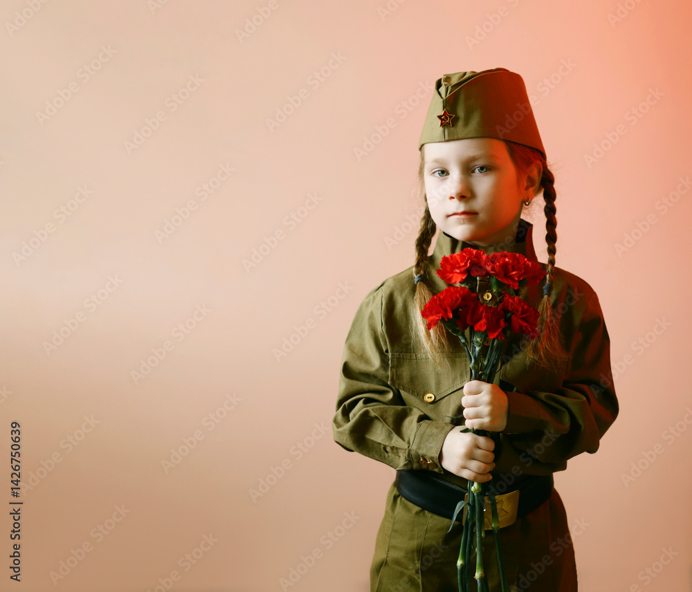 Obraz premium portrait of a girl with flowers on Victory Day in May in a green military suit