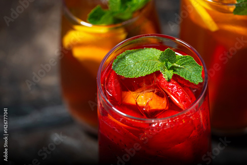 glasses of refreshing cold black and fruit tea, top view