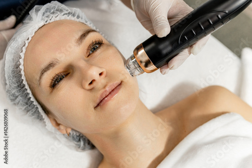 Microneedle RF lifting procedure. Hardware cosmetology. High quality photo