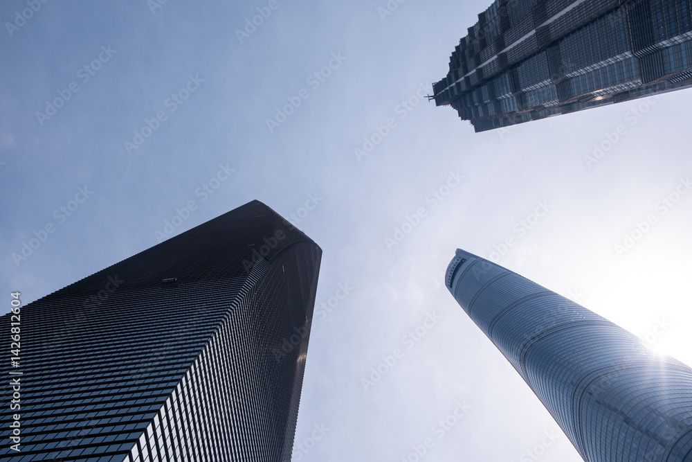 Shanghai city buildings against blue sky, High rise business offices, low angle