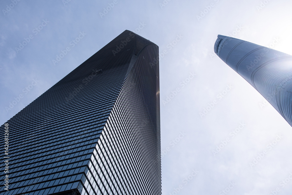 Shanghai city buildings against blue sky, High rise business offices, low angle