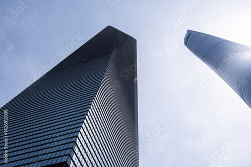 Obraz na płótnie Shanghai city buildings against blue sky, High rise business offices, low angle w salonie
