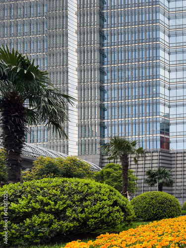 Obraz na płótnie Shanghai city high rise buildings and colorful flowerbed, China w salonie