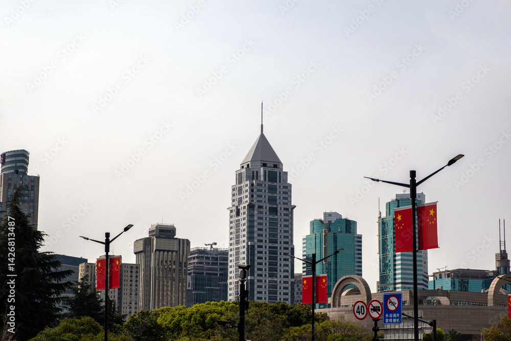 China, Shanghai city downtown. High rise buildings, chinese flags and traffic signs