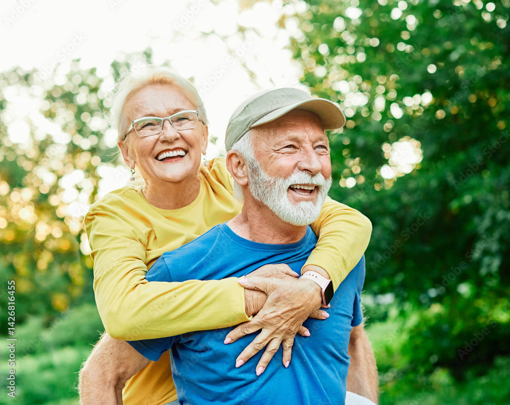 outdoor senior fitness woman man love active fun piggyback exercise healthy fit sport retirement happy adult couple mature exercising nature activity old elderly wife husband embracing