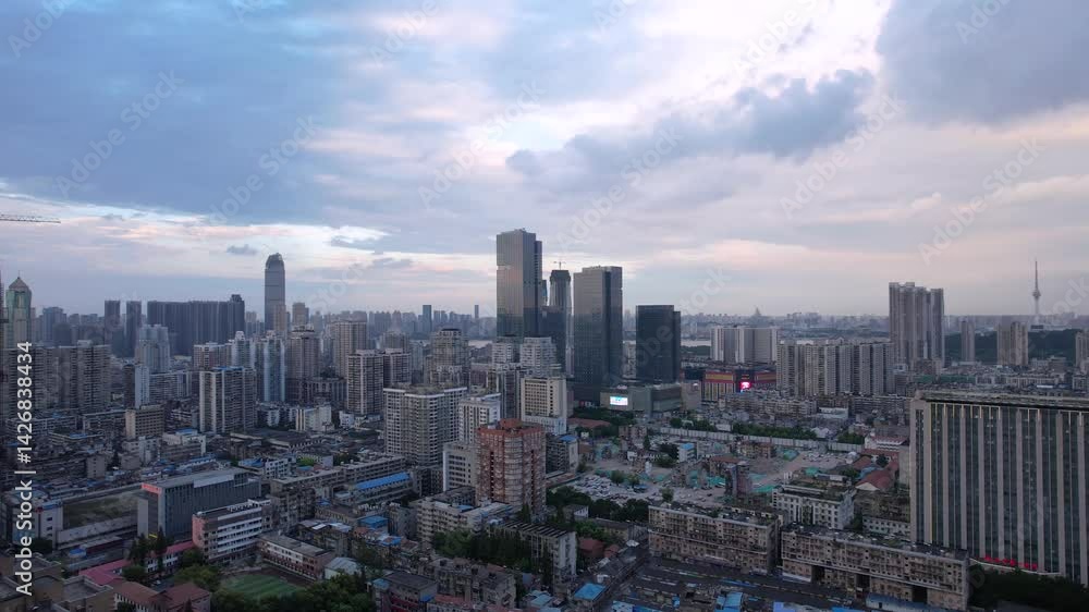 Skyline view of a vibrant city during evening sunset showcasing tall buildings and urban landmarks Skyline view of a vibrant city during evening sunset showcasing tall buildings and urban landmarks