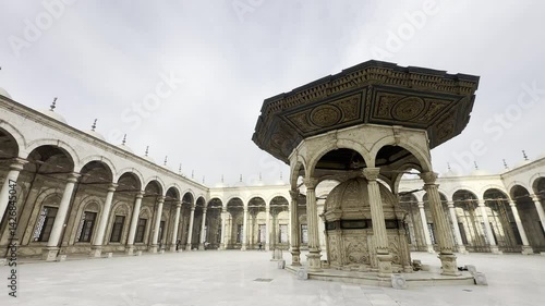 Capture the Mohammed Ali Mosque sahn, alabaster courtyard with clock tower. Ideal for projects showcasing Cairo's medieval Islamic architecture and design details.