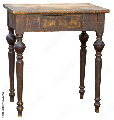 Obraz na płótnie A vintage wooden table featuring ornate legs and a single drawer stands in a bright room. Its warm finish adds character to the space, enhancing the rustic atmosphere. w salonie