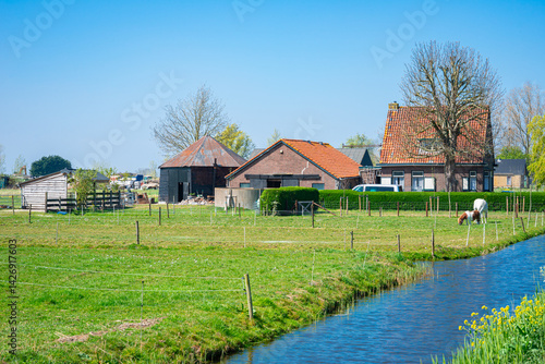 Idyllic view of a farmhouse in the low lying Zuidplaspolder, north of Rotterdam, Netherlands