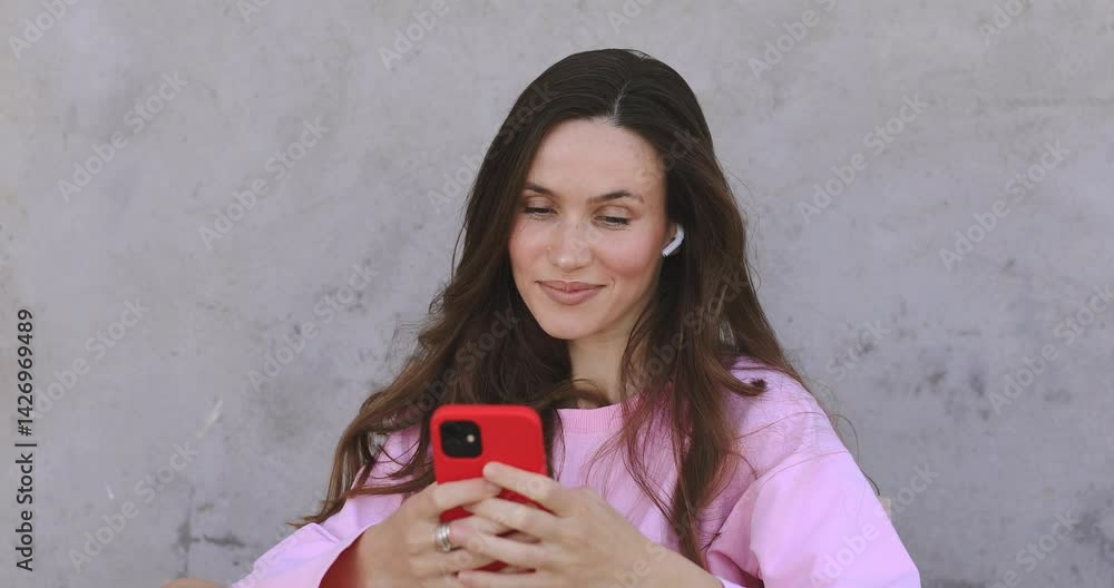 Happy pretty girl user holding cell phone using education tech apps looking at smartphone texting messages, smiling. Mobile online applications concept. Happy pretty girl user holding cell phone using education tech apps looking at smartphone texting messages, smiling. Mobile online applications concept.