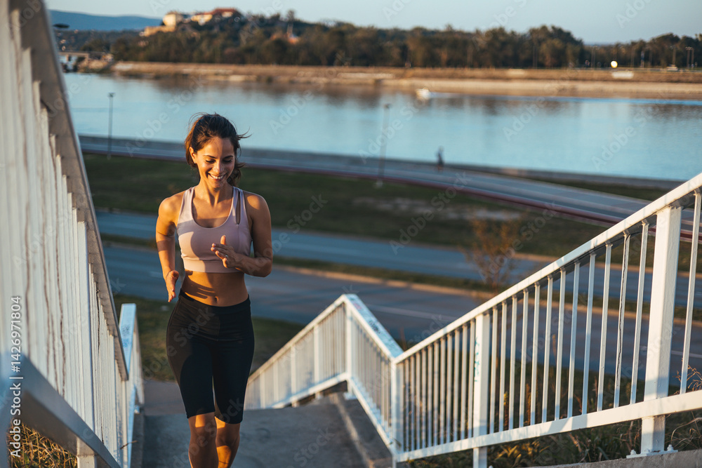 Athletic Woman Jogging Upstairs During a Scenic Outdoor Fitness Routine