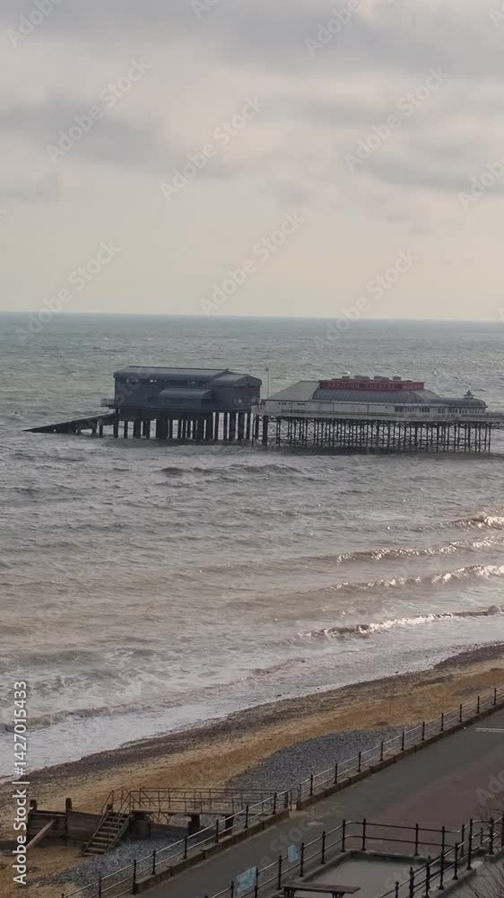 The theatre and lifeboat station on Cromer pier on the North Norfolk coast. Vertical video optimised for social media, reels and stories. Static camera shot The theatre and lifeboat station on Cromer pier on the North Norfolk coast. Vertical video optimised for social media, reels and stories. Static camera shot