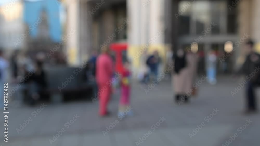 Walking people in a megalopolis in the daytime with a blurred background. The mysterious way of urban life Walking people in a megalopolis in the daytime with a blurred background. The mysterious way of urban life