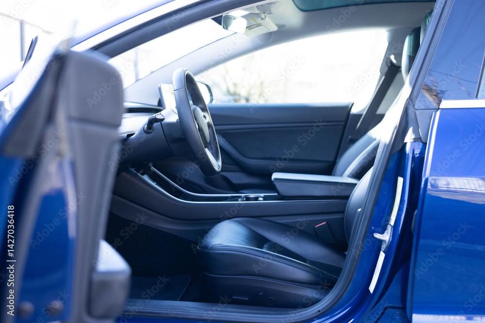 Car interior luxury inside. Steering wheel, dashboard, speedometer, display. Black leather interior. Modern luxury car Interior - steering wheel, shift lever and dashboard Car interior luxury inside. Steering wheel, dashboard, speedometer, display. Black leather interior. Modern luxury car Interior - steering wheel, shift lever and dashboard