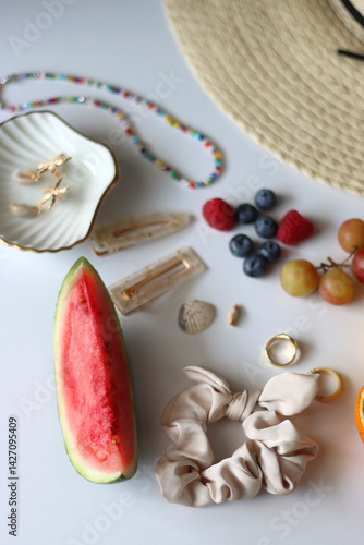 Obraz na płótnie Straw hat, sunglasses, seasonal fruit, seashells and colorful accessories on white backgrounds. Cute summer essentials. Selective focus. w salonie