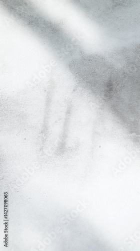 Macro shot of light grey concrete with soft shadow details