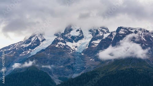 Wallpaper Mural A picturesque mountainous landscape with clouds shrouding the summit, suggesting either a volcanic or tropical location. Torontodigital.ca