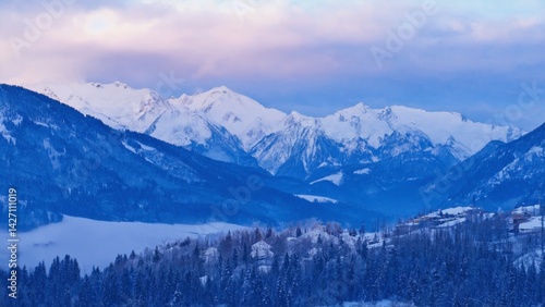 Wallpaper Mural Scenic view of snow-capped alpine peaks in a valley below with a smattering of houses and trees. Torontodigital.ca