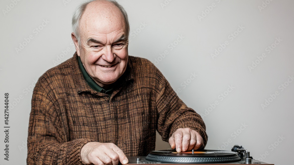 Elderly senior man in headphones with vinyl record player listening to music at home
