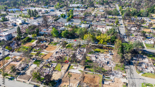 Aerial shot of fire damaged businesses and homes on Lake Street in Altadena California USA