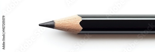 Close-up of a sharpened black pencil on white background. (1)