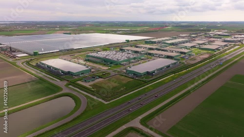 Data facility stretches across land in rural Netherlands. Aerial drone video