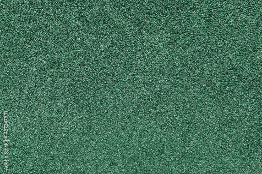 Fototapeta premium Grainy texture of asphalt, plaster, cement, plastic, rock, stone close up, macro. Background of green colored granular wall surface, rough backdrop