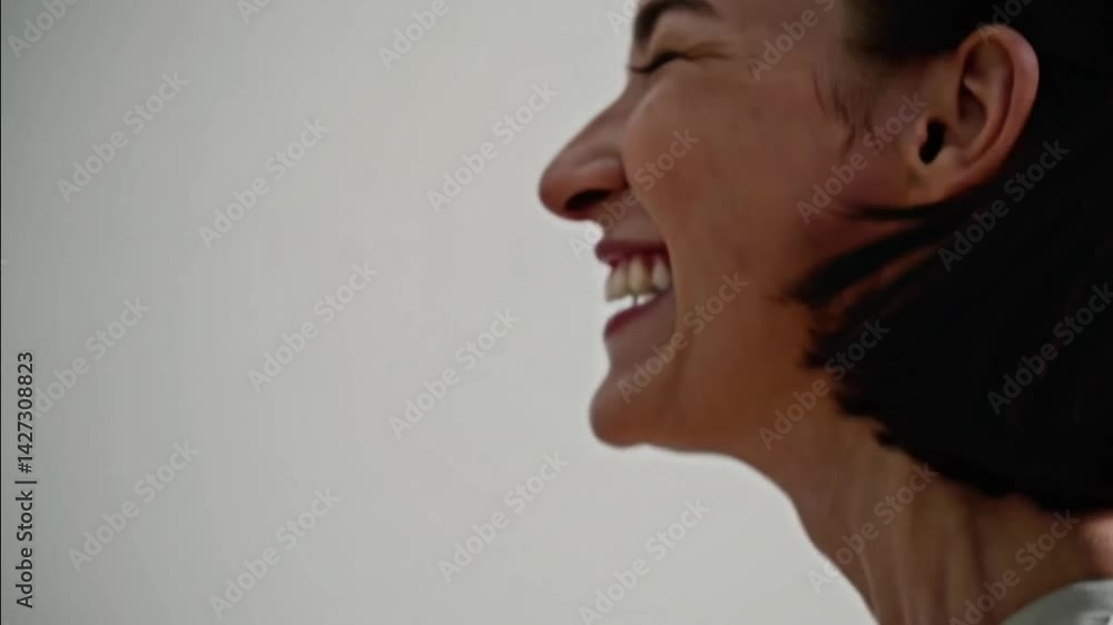 Woman shouting loud with open mouth aggressive expression short hair and white background showing neck skin Woman shouting loud with open mouth aggressive expression short hair and white background showing neck skin