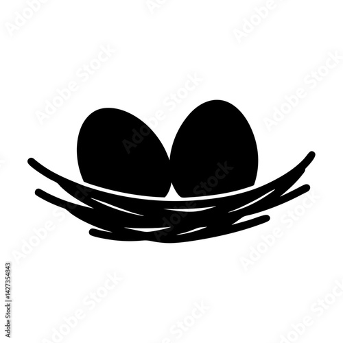Two eggs sitting comfortably in a nest of twigs silhouette image