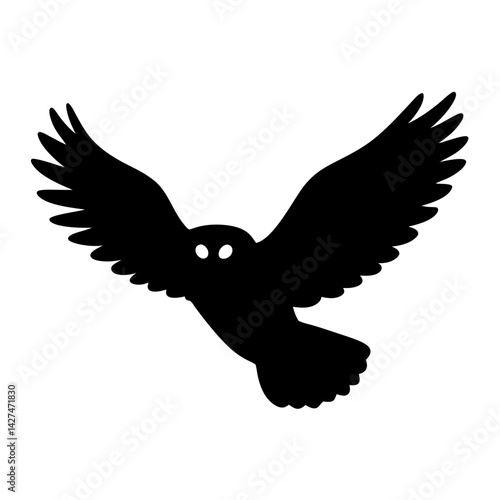 Black Silhouette of an Owl in Flight with Wings Spread Wide Open