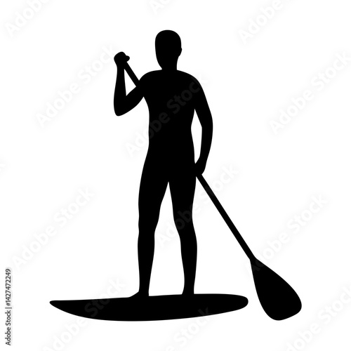 Silhouette of a man stand up paddleboarding with paddle in water